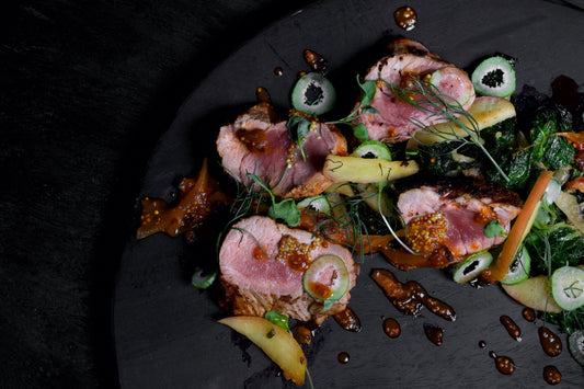 PORK TENDERLOIN WITH VEGETABLE SAUTE AND SPICY BACON-ONION JUS.