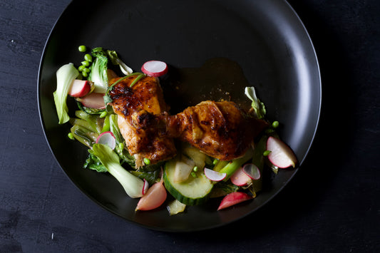 SWEET AND SPICY SOY GLAZED SPATCHCOCK CHICKEN WITH SAUTÉED BABY BOK CHOI AND SNAP PEAS.